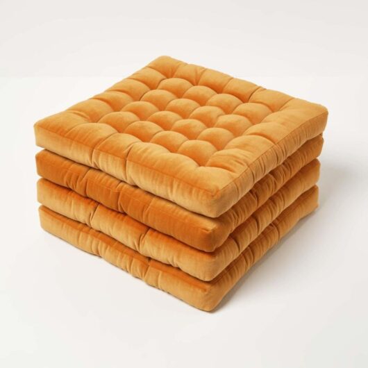 Homescapes - Set of 4 Burnt Orange Quilted Velvet Chair Pad, 40 x 40 cm